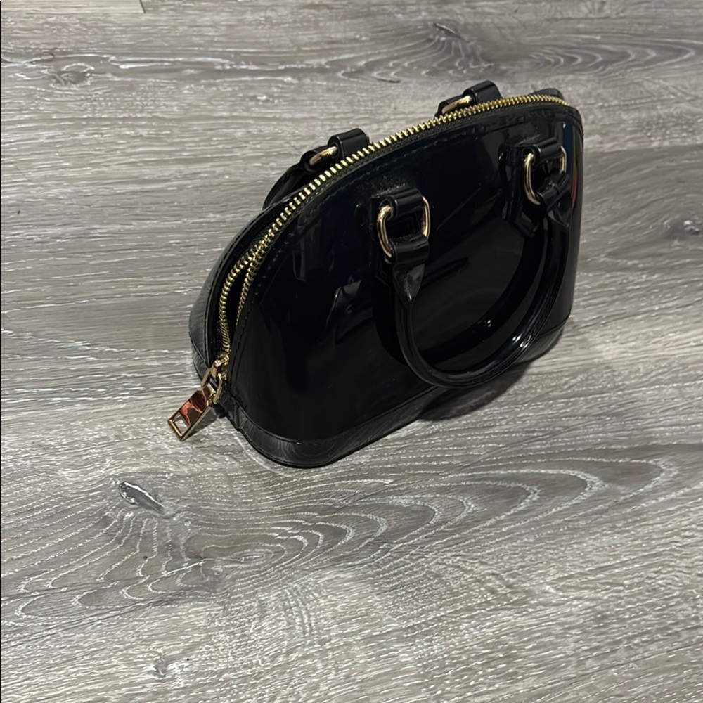 Glossy Black Mini Bag with Structured Oval Design